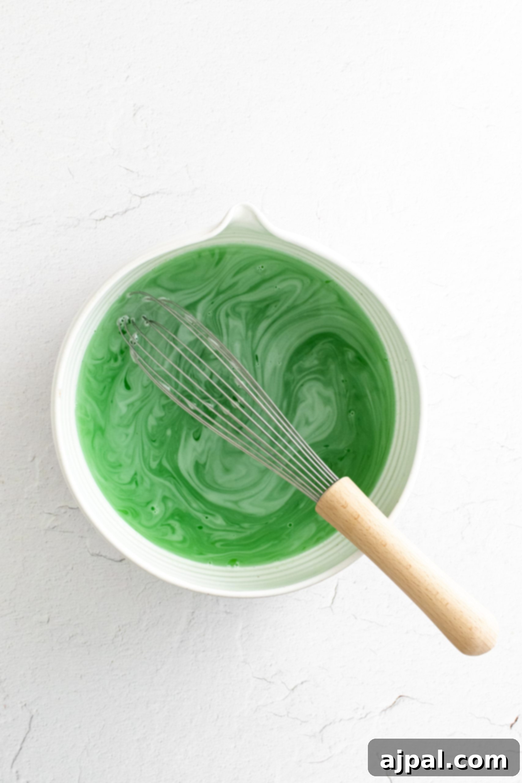 Layered green jello in a bowl.