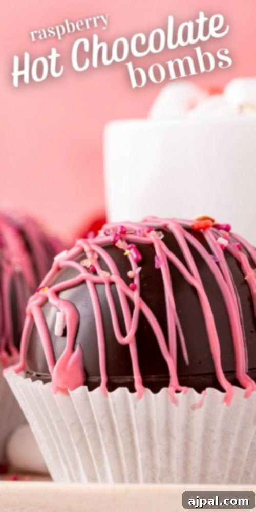 Berry Burst Hot Cocoa Spheres 26 Recipe card image: Raspberry hot chocolate bombs.