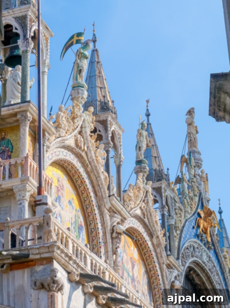 The grand and historic exterior of St. Mark's Basilica in Venice, showcasing its intricate architecture and iconic domes.
