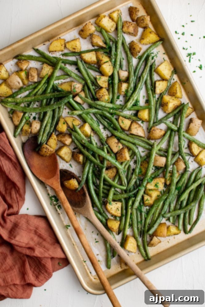 Savory Herb Roasted Green Beans and Potatoes 2 sheet pan with green beans and potatoes roasted on it