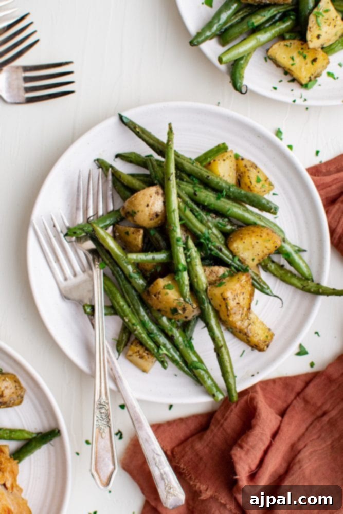 Savory Herb Roasted Green Beans and Potatoes 7 sheet pan with green beans and potatoes roasted on it
