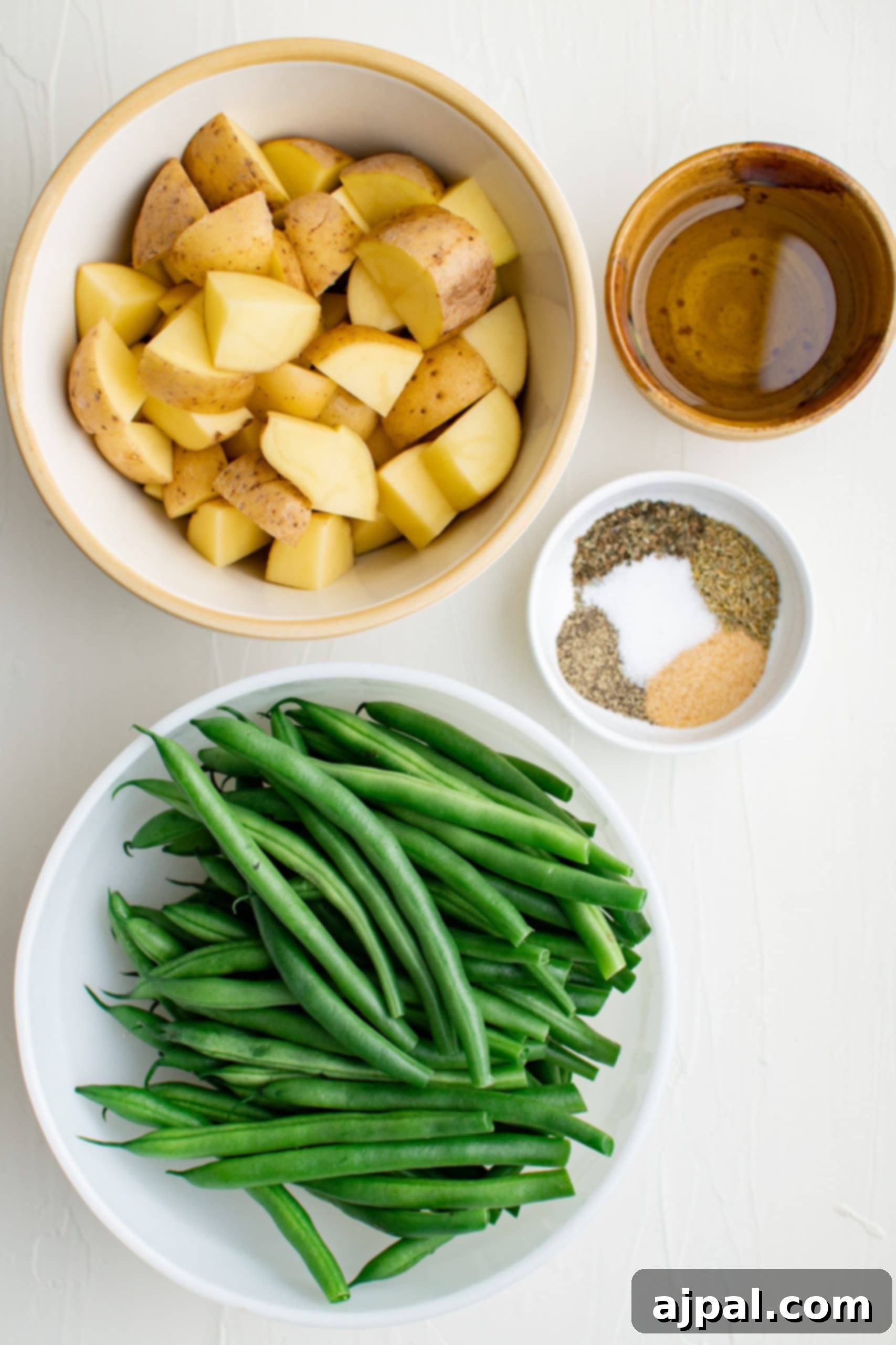 Savory Herb Roasted Green Beans and Potatoes 8 Roasted green beans and potatoes with spices.