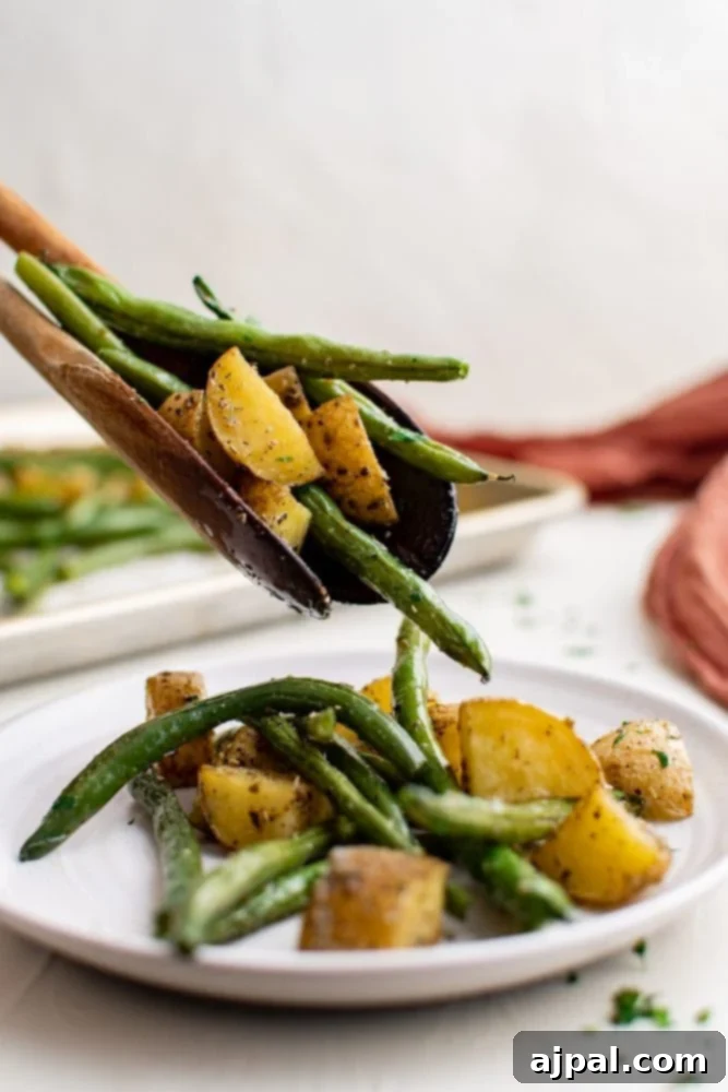 Savory Herb Roasted Green Beans and Potatoes 3 sheet pan with green beans and potatoes roasted on it