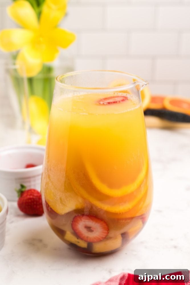 orange drink with sliced fruit in it