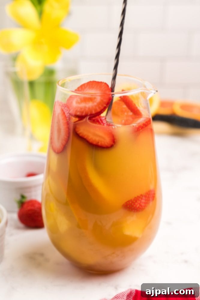 fruit and orange juice in a jar