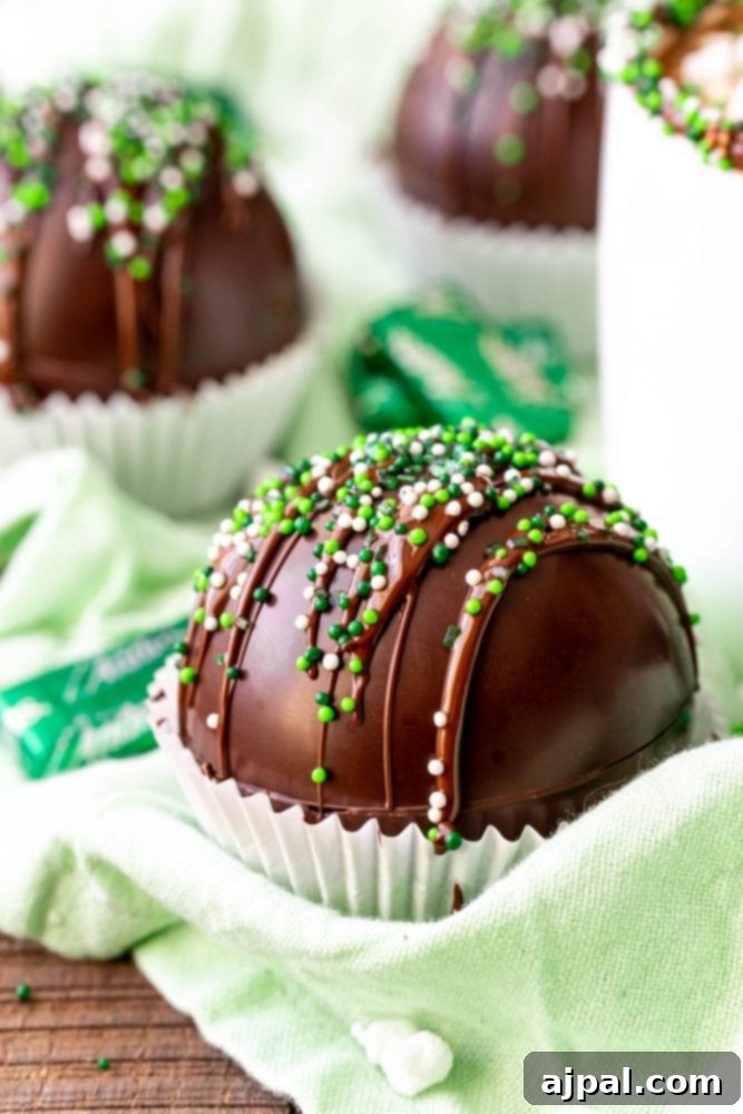 Irresistible Mint Hot Chocolate Bombs 2 chocolate bomb in a cupcake liner with green sprinkles