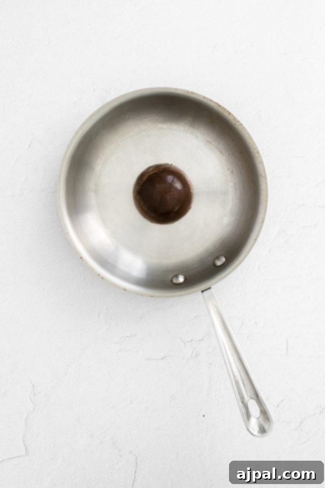 Irresistible Mint Hot Chocolate Bombs 12 chocolate sphere in a stainless steel pan