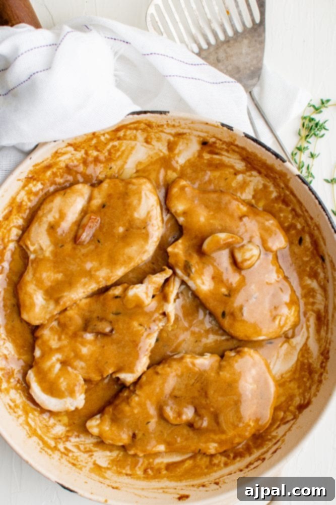 Creamy Garlic Chicken Made Simple 12 Creamy garlic chicken breasts cooked in a skillet with thyme-infused gravy.