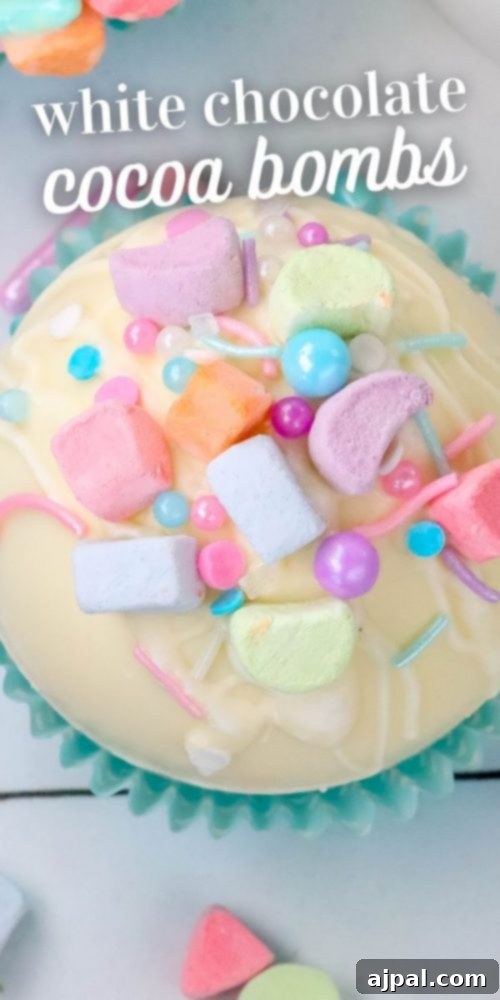 Magical White Chocolate Lucky Charms Bombs 8 white chocolate hot chocolate bomb in a blue cupcake wrapper with lucky charms marshmallows and sprinkles on top