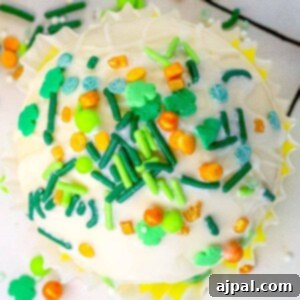 St. Patrick's Day cupcake with green frosting and sprinkles.