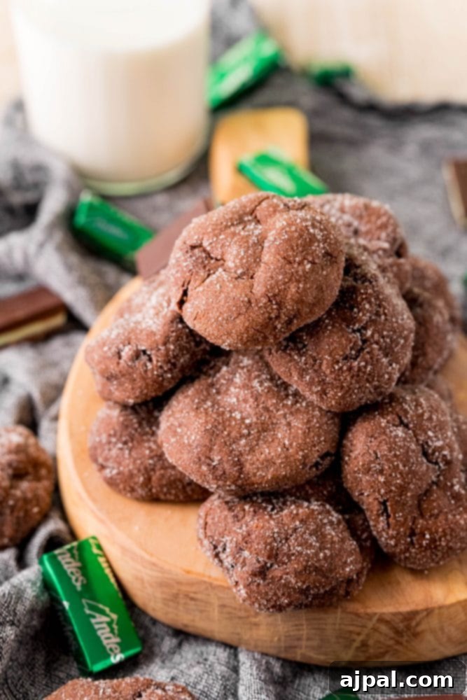 Andes Mint Lava Cookies 12 chocolate cookies stacked on a board with andes mints all over