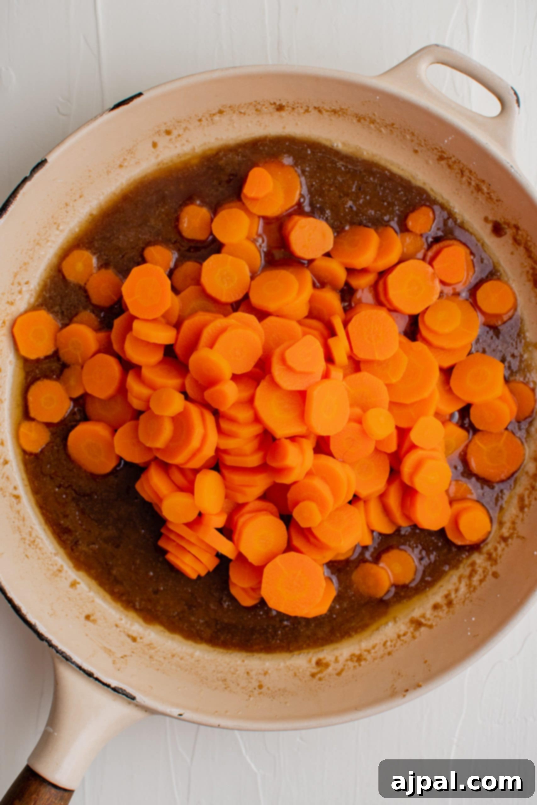 Sugar glazed carrots in a brown sauce.