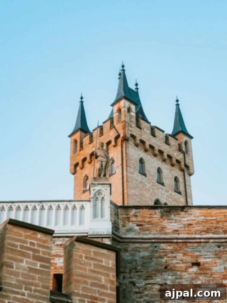The majestic Hohenzollern Castle, a turreted fortress atop a mountain in Germany.