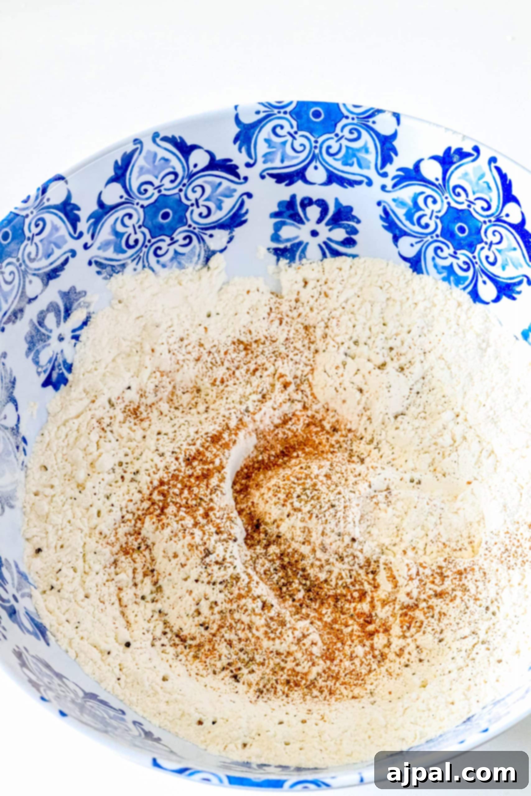 Effortless Homemade Spaetzle 3 A blue and white bowl with German spaetzle dumplings recipe.
