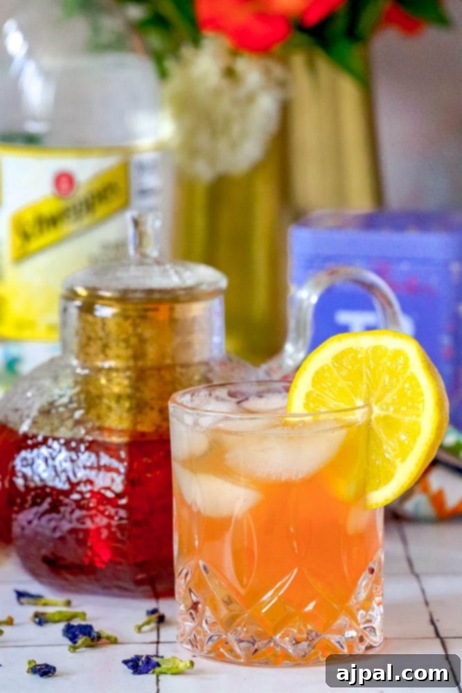 Bubbly Earl Grey Tea Tonic 5 A close-up of an Earl Grey Sparkling Tea and Tonic with a lemon slice, highlighting its refreshing qualities.