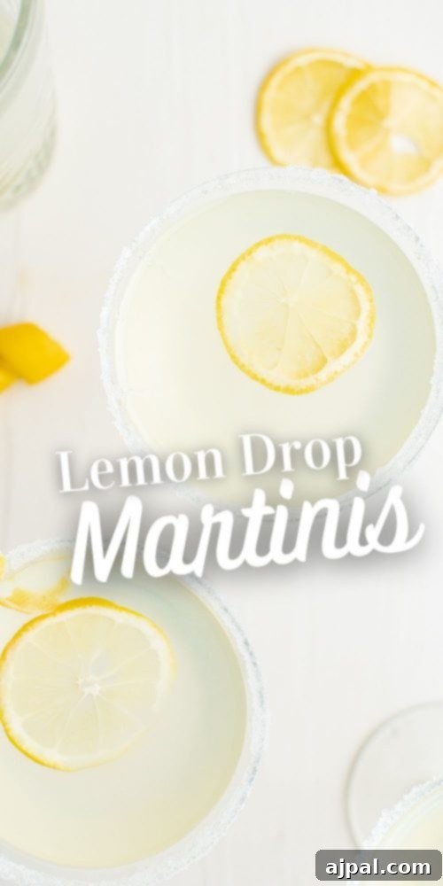Zesty Lemon Drop Martini Recipe 10 light yellow drink with sliced lemon and salt around the rim