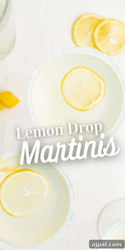 A refreshing Lemon Drop Martini cocktail on a clean white surface, perfectly highlighting its vibrant lemon notes.