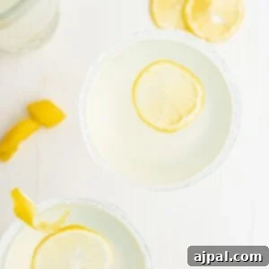 Lemon margaritas with a slice of lemon, perfect for a refreshing twist on the classic lemon drop martini recipe.