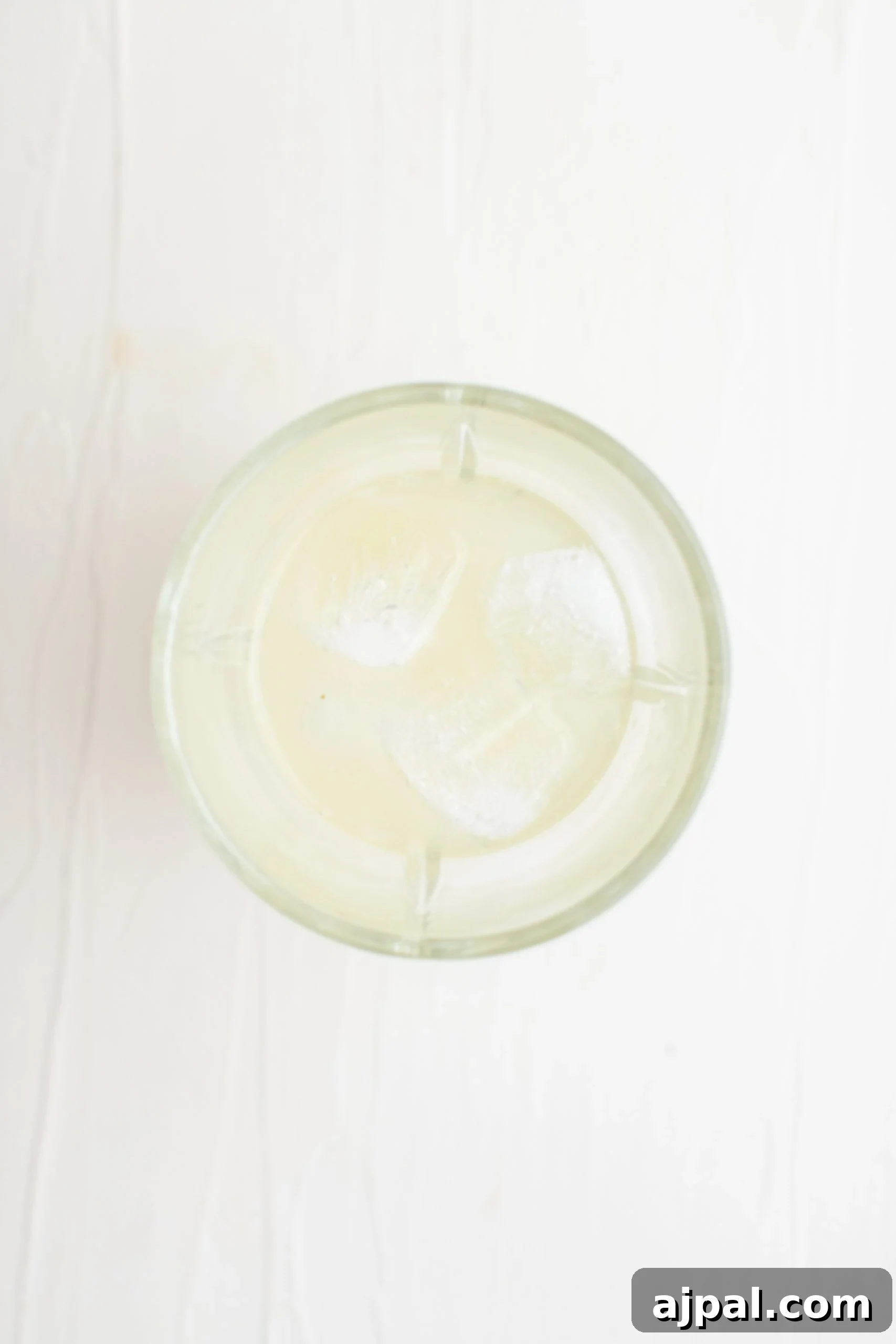 Fresh lemons and a measuring jigger, key ingredients for a vibrant Lemon Drop Martini.