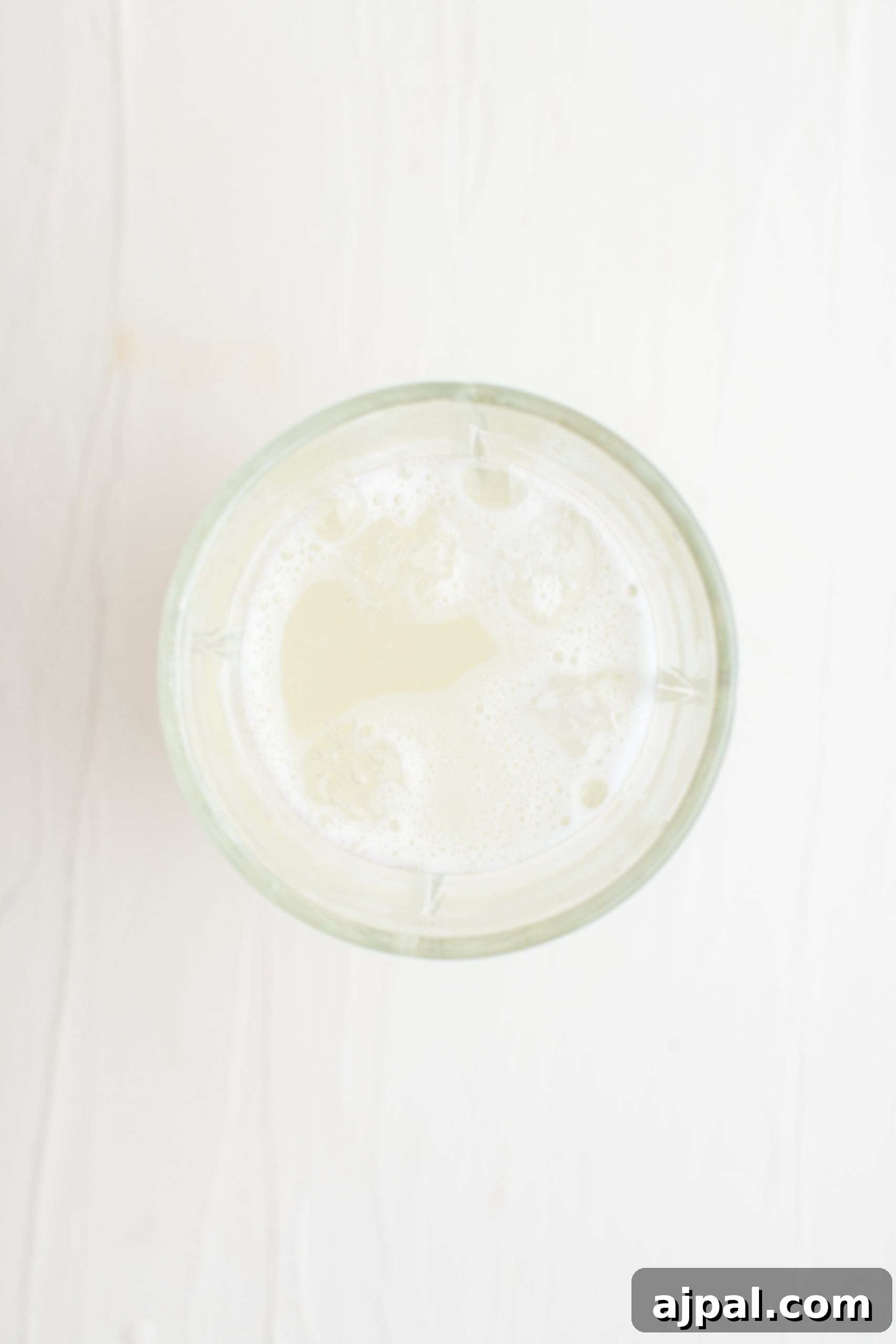 Zesty Lemon Drop Martini Recipe 6 A glass of milk on a white background.