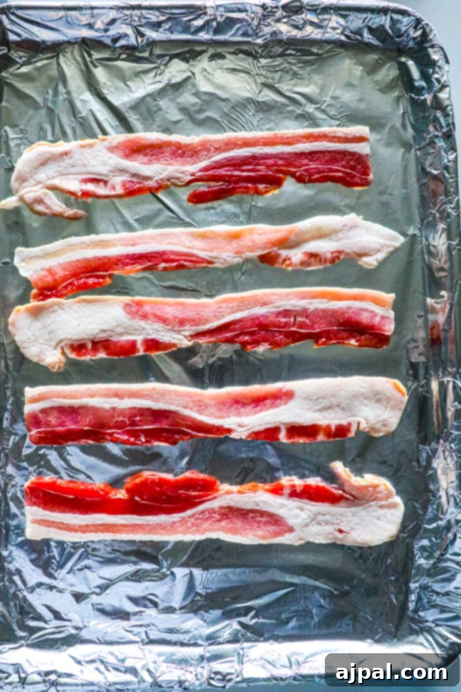 Bacon wrapped in foil, baked on a sheet.