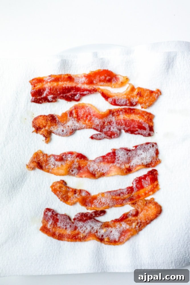The best baked bacon recipe served on a white plate.