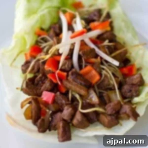 Keto beef lettuce wraps served on a white plate.
