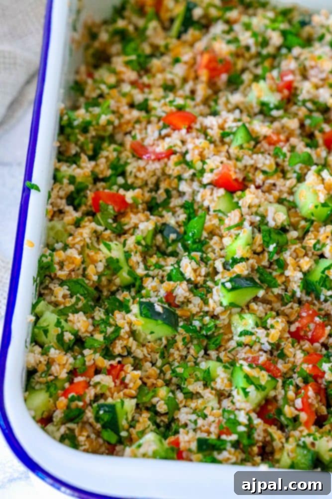 Picture of tabbouleh in a dish, showing the harmonious blend of bulgur, herbs, and vegetables.