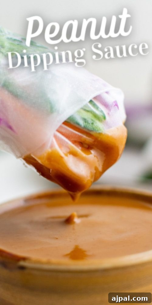 A beautiful pour shot of creamy peanut dipping sauce into a serving bowl, highlighting its perfect texture.
