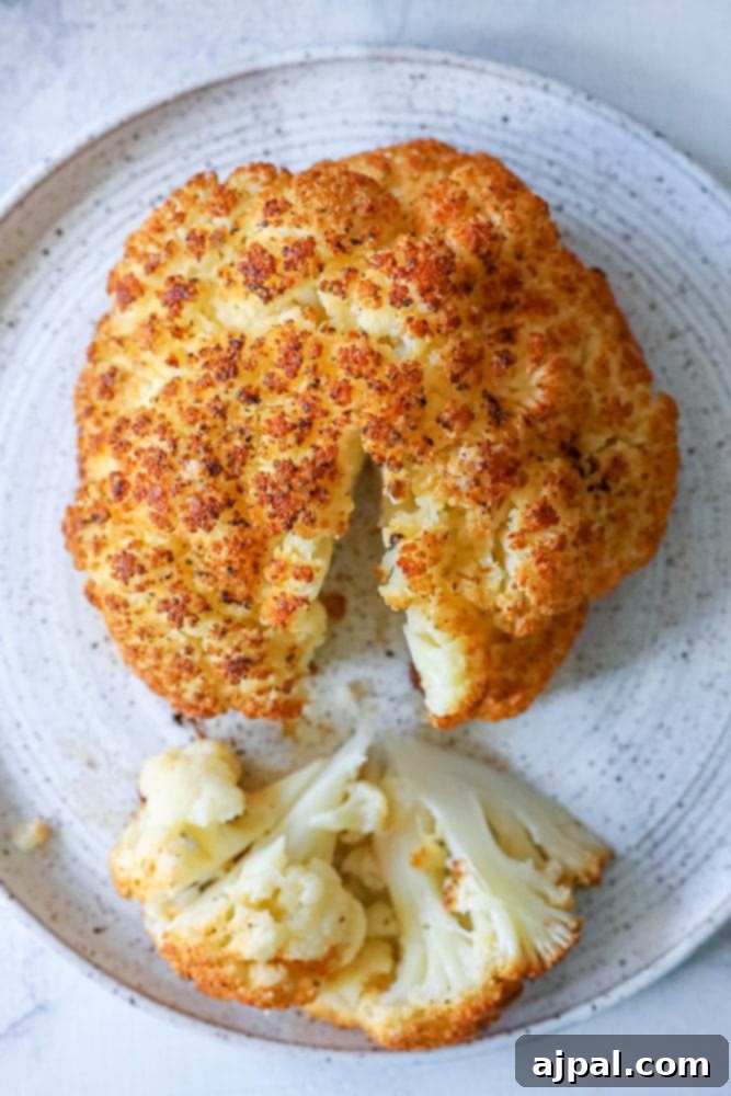 whole roasted cauliflower head on a plate