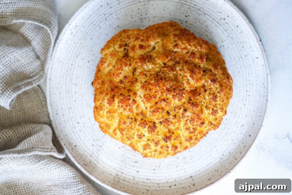 whole roasted cauliflower head on a plate