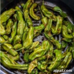 A close-up of shishito peppers in a bowl, ready for air frying.