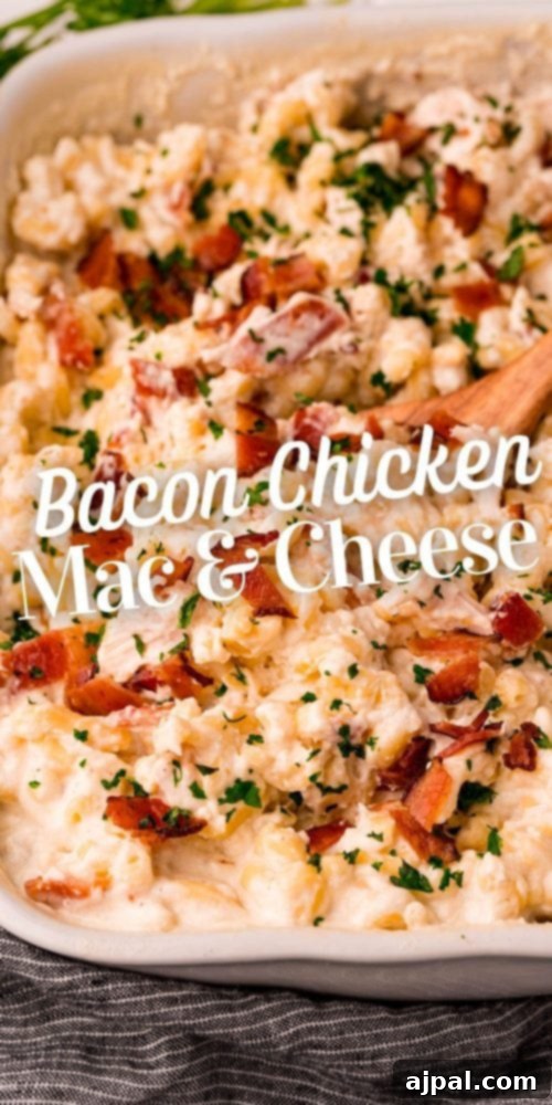 Loaded Bacon Ranch Chicken Mac and Cheese 12 A large baking dish filled with creamy bacon chicken ranch macaroni and cheese, garnished with fresh herbs and extra crispy bacon, ready to serve as a satisfying meal.