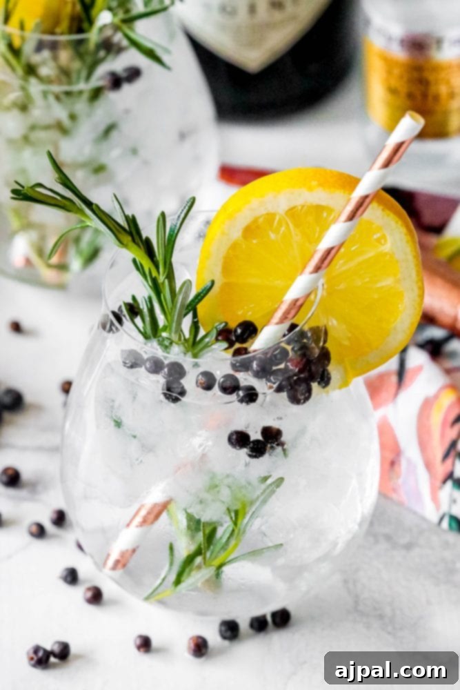 A refreshing gin cocktail infused with rosemary and blackberries.
