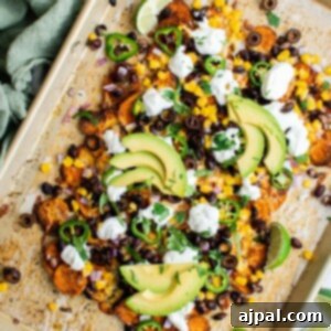 Easy Sweet Potato Nachos Recipe: Vegetarian twist on classic nachos using Mexican flavors and baked sweet potatoes.