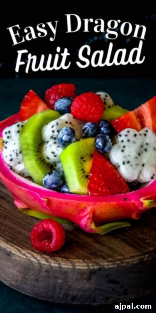 Tropical Dragon Fruit Salad 7 Picture of a refreshing diced fruit salad in a carved out dragon fruit hull, showcasing an easy dragon fruit salad recipe.