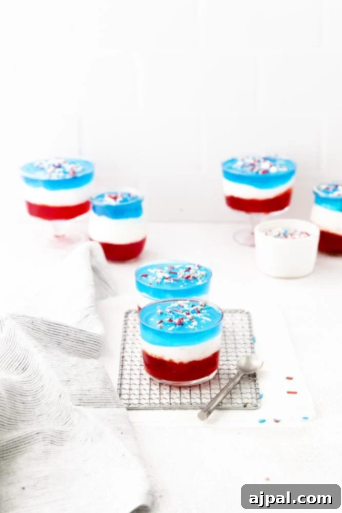 Star-Spangled Jello Cups 11 Fourth of July desserts displayed on a cooling rack.