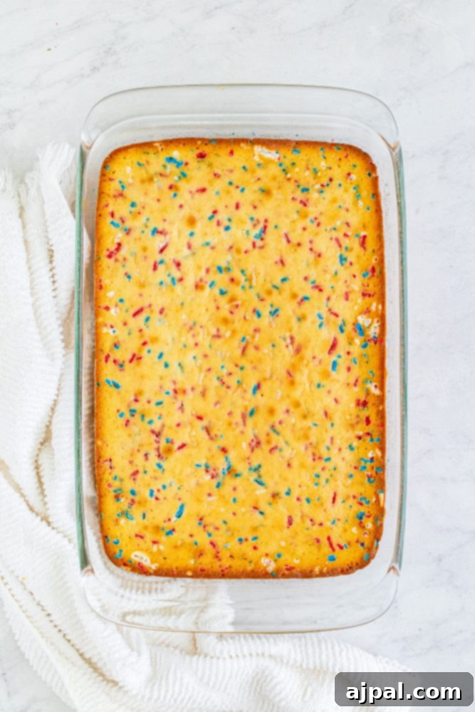 baked red white and blue funfetti cake in a pan