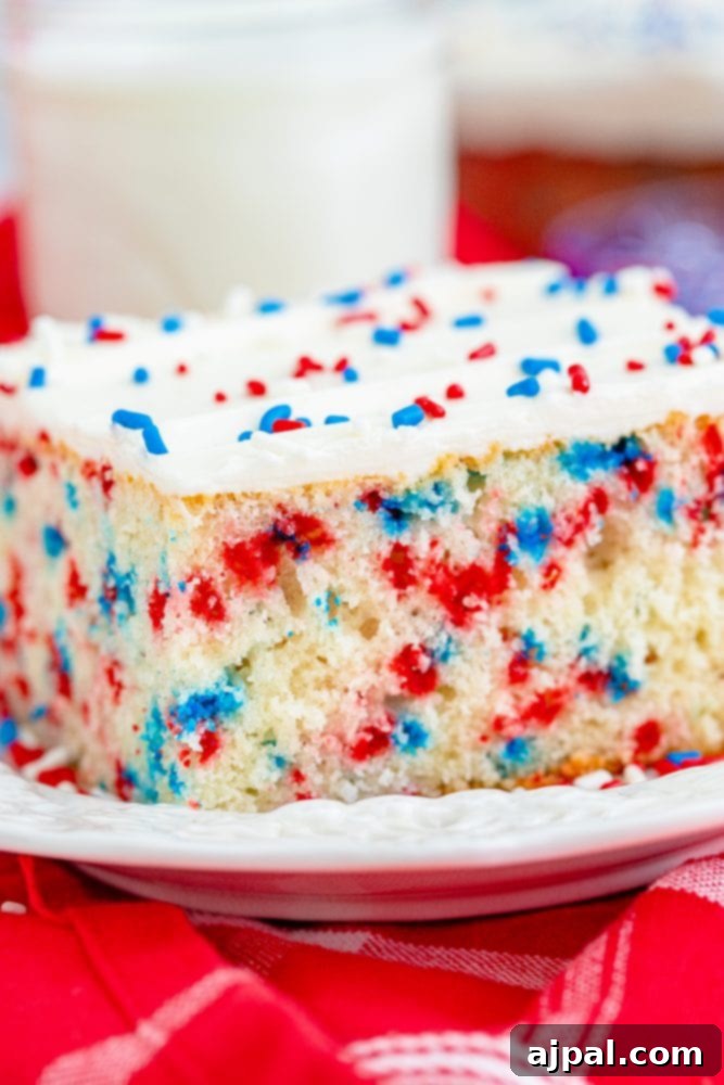  red white and blue funfetti sheet cake on a plate