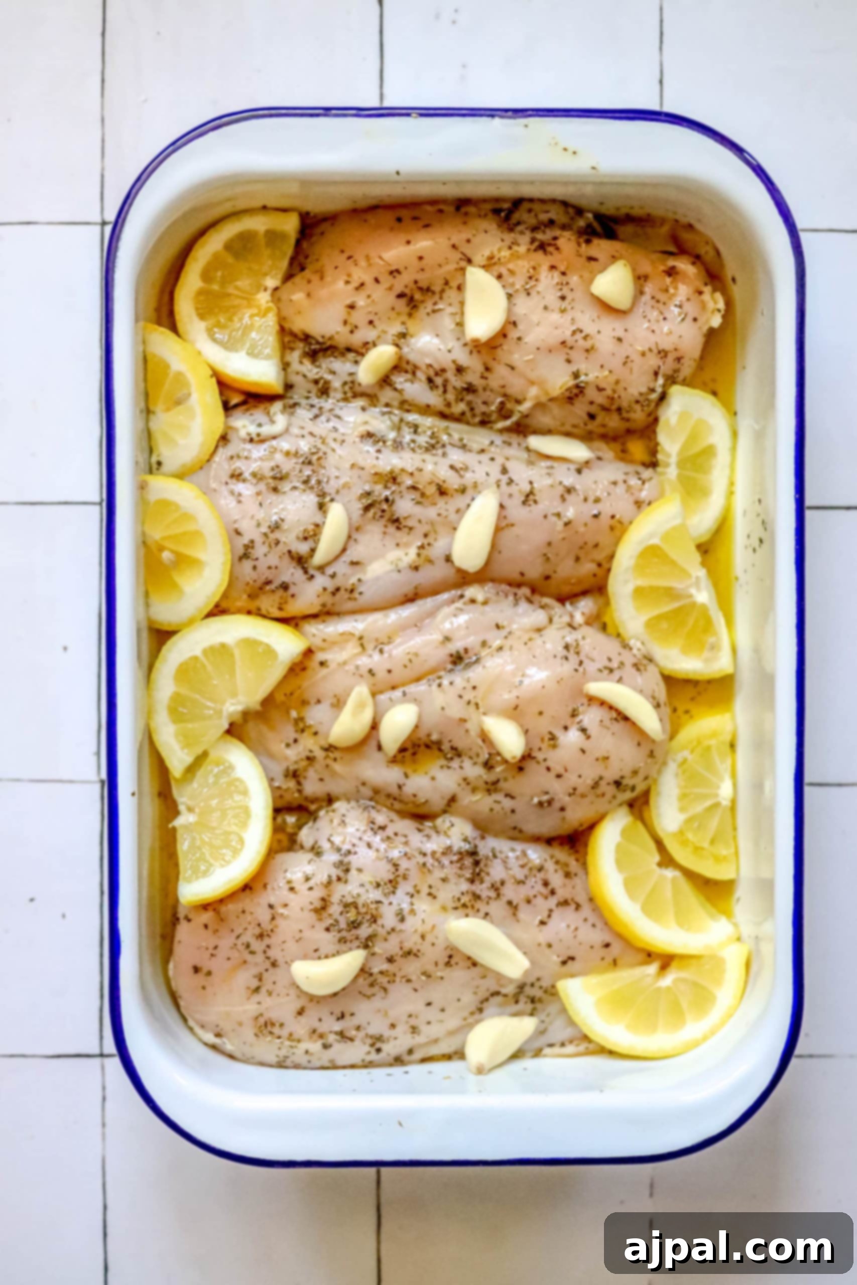 Quick and Easy Garlic Lemon Baked Chicken Breasts 6 Baked chicken breasts with lemon slices.