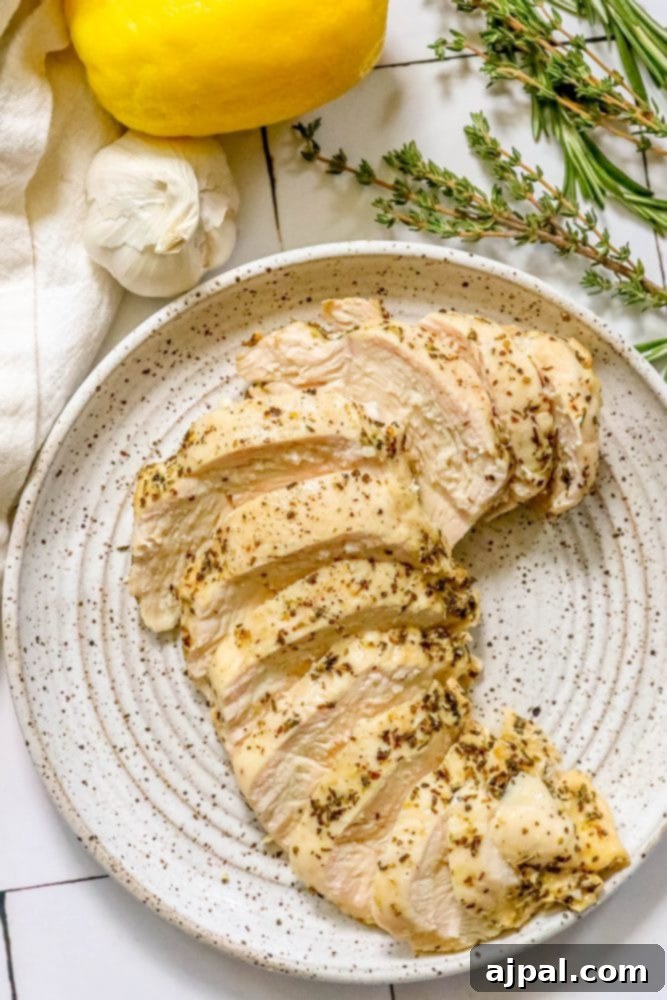 Quick and Easy Garlic Lemon Baked Chicken Breasts 8 Lemon garlic chicken breasts served with herbs and lemons.