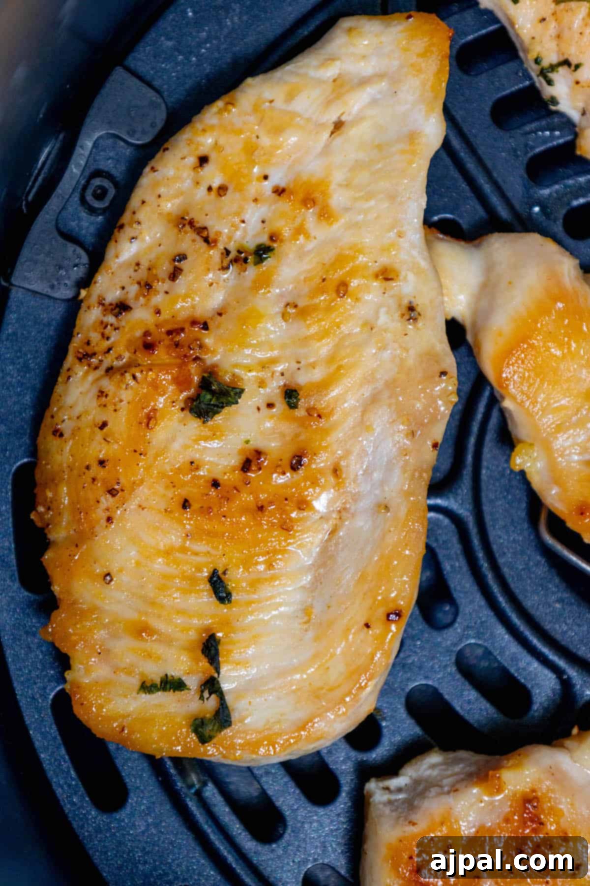 The Best Air Fried Chicken Breasts Recipe. Golden brown and perfectly cooked chicken breasts arranged appealingly.