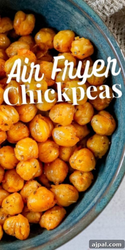 Zesty Air Fried Chickpea Crunch 5 Air fried garbanzo beans seasoned with lemon pepper in a blue bowl.