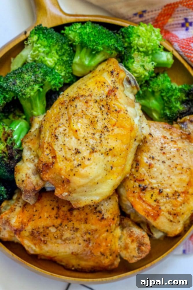 Crispy Air Fryer Chicken Thighs 2 Chicken and broccoli cooked in a skillet using easy air fryer chicken thighs.