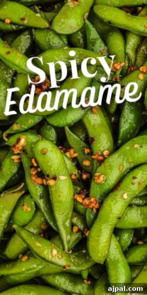 A beautifully presented bowl of spicy green edamame peas, perfectly seasoned.
