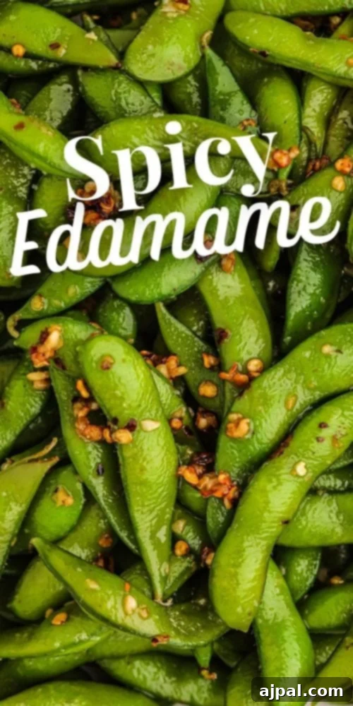A vibrant and appetizing bowl of spicy green edamame peas, perfectly seasoned and ready to be served, capturing the essence of a delicious and healthy snack.