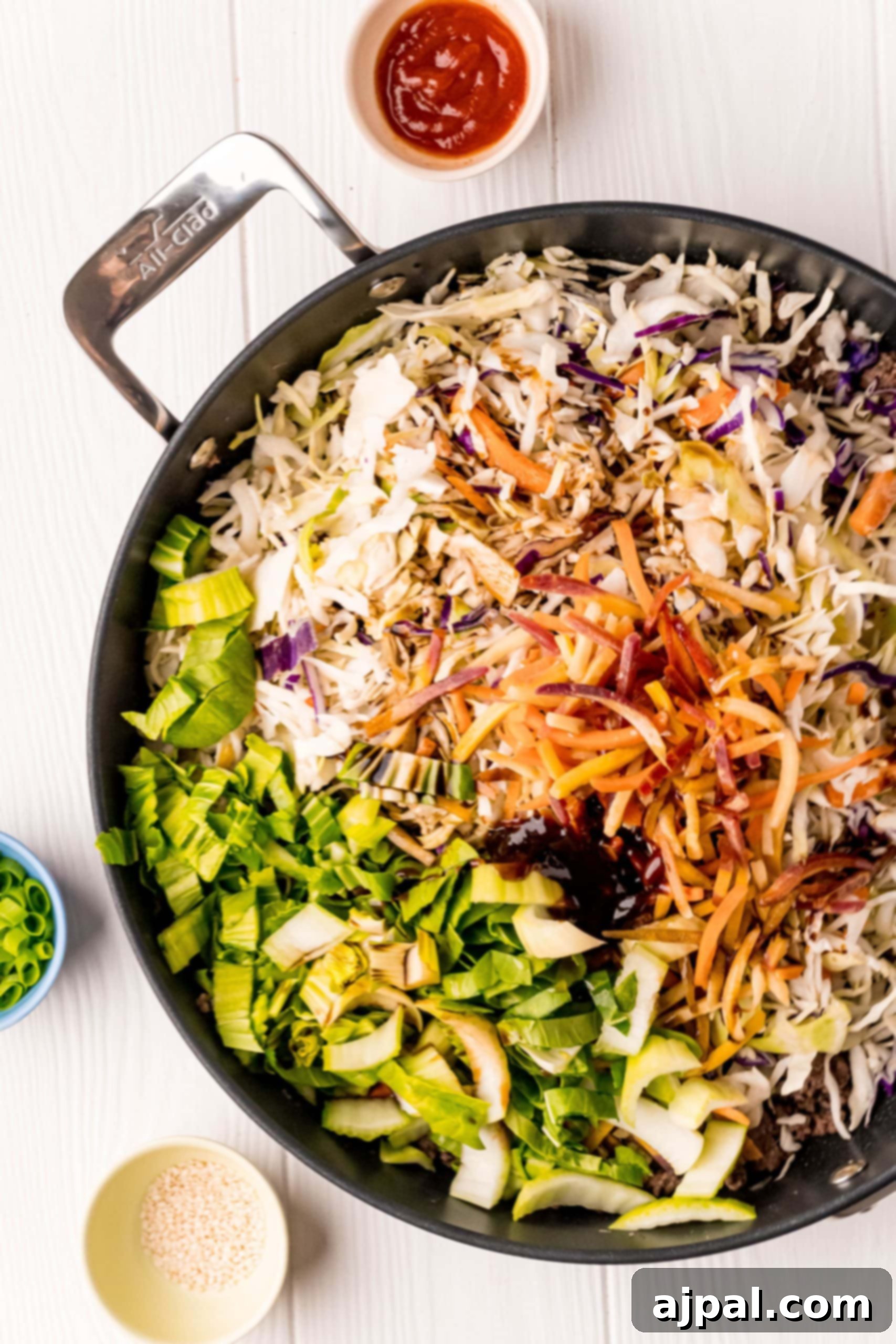 A keto egg roll stir fry with vegetables in a pan.