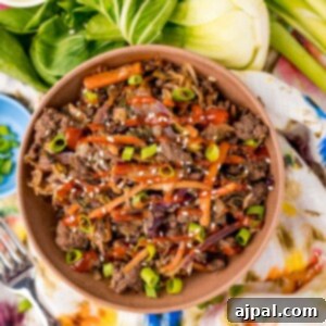picture of egg roll in a bowl with bok choy in the background