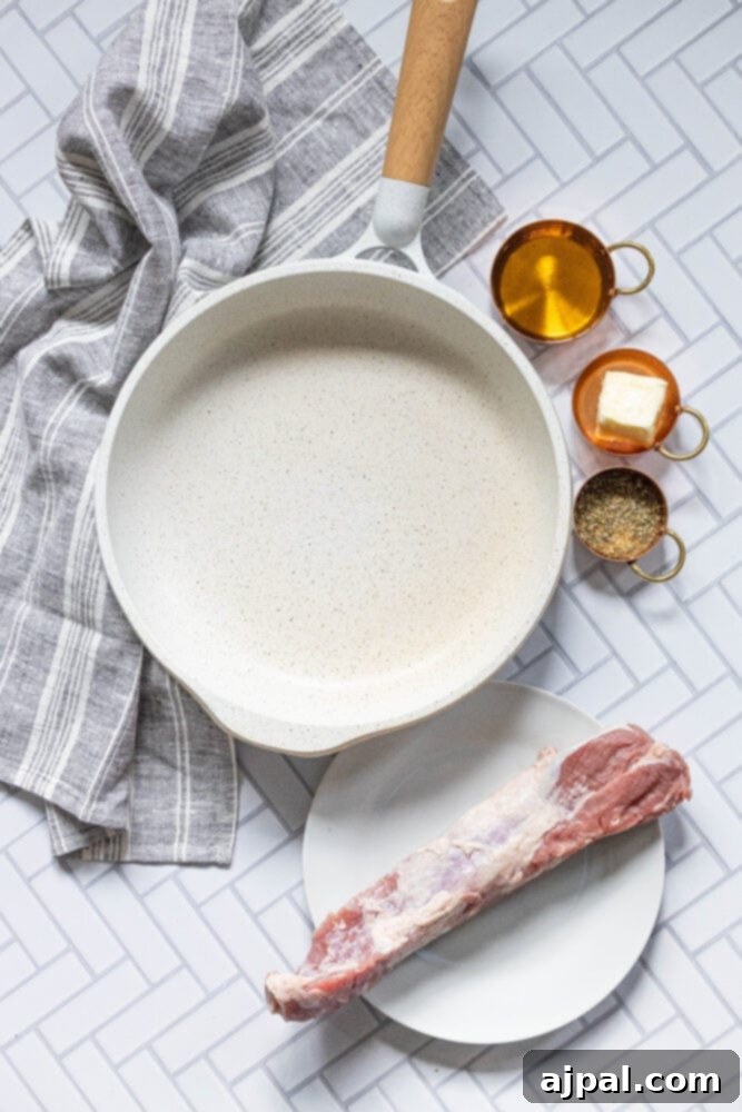 Best Baked Teriyaki Pork Tenderloin 5 picture of pork, olive oil, herbs, and a pan on a table