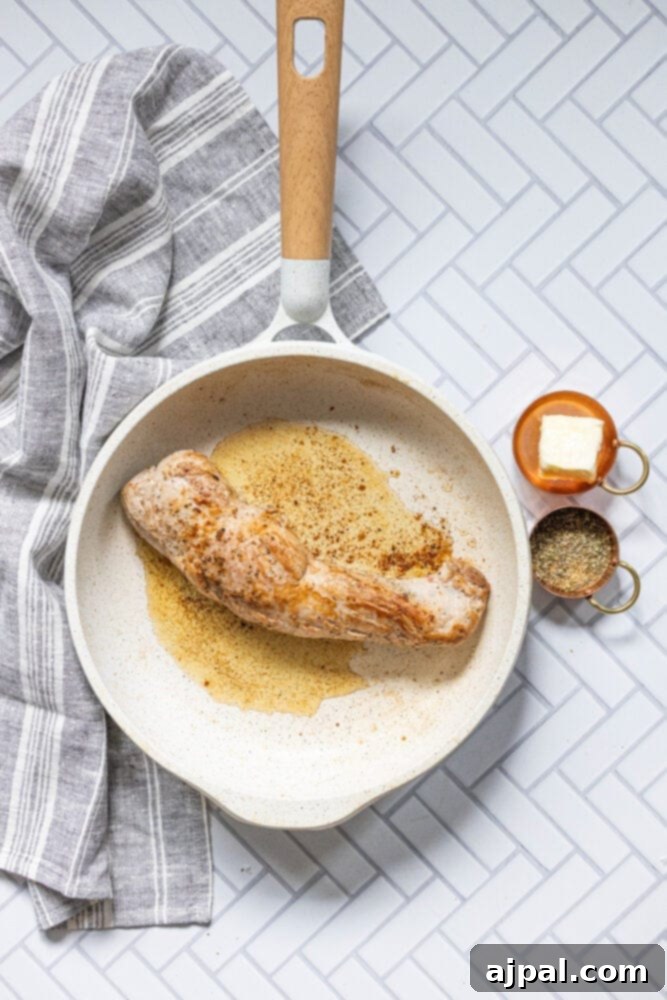 Best Baked Teriyaki Pork Tenderloin 8 picture of pan with browned pork tenderloin in it